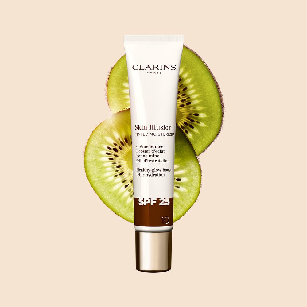 Packshot of the 40ml tube of Skin perfector Skin Illusion Tinted Moisturiser shade 10 placed next to kiwi slides