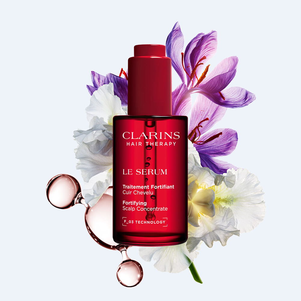 Clarins scalp serum for hair longevity and density, enriched with saffron and organic plant extracts to support scalp health.
