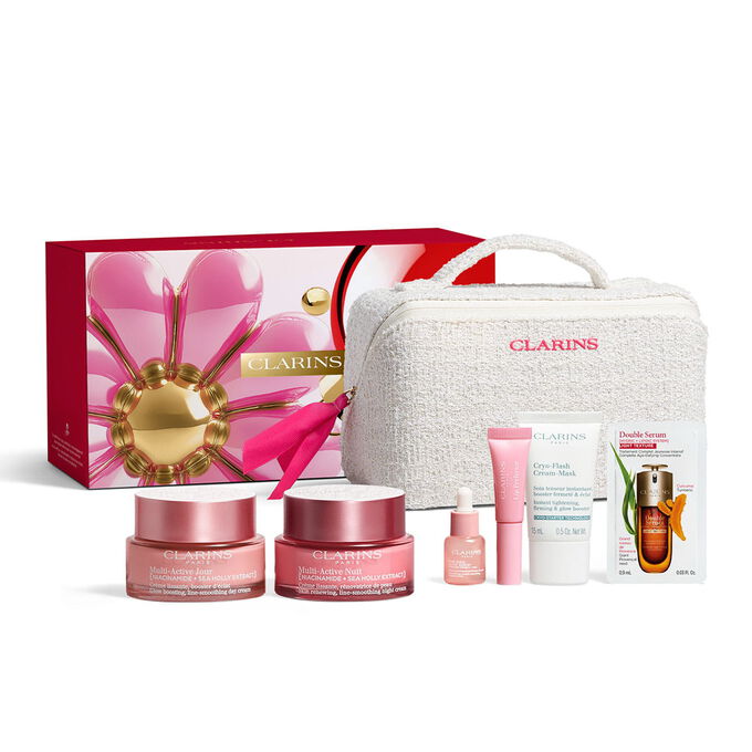 Clarins multi active skincare set with full size niacinamide day and night creams for 30s skin inside a vanity pouch.