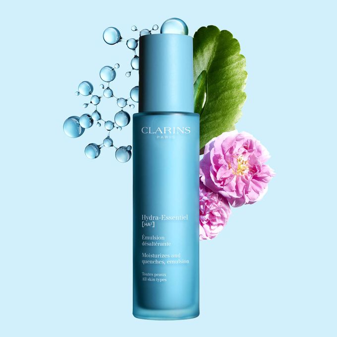 Packshot of Clarins Hydra-Essentiel 23 Emulsion close to a Damascus rose and a Kalanchoe leave on a blue background.