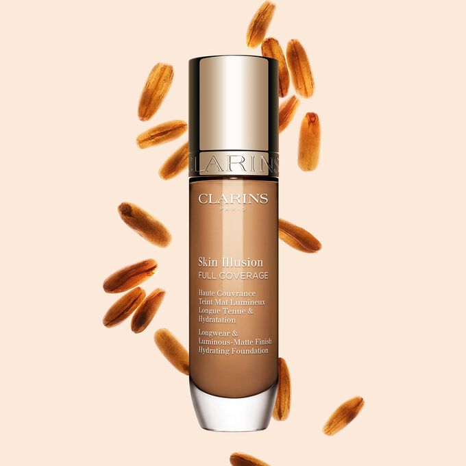 Clarins Skin Illusion Full Coverage showcasing its sleek design and vibrant packaging, the ideal foundation for a flawless & natural complexion.