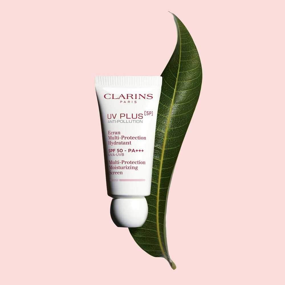 Packshot of a tube of Clarins UV Plus Anti-Pollution Rose, a Moisturising Fluid with SPF 50 on a pink background.