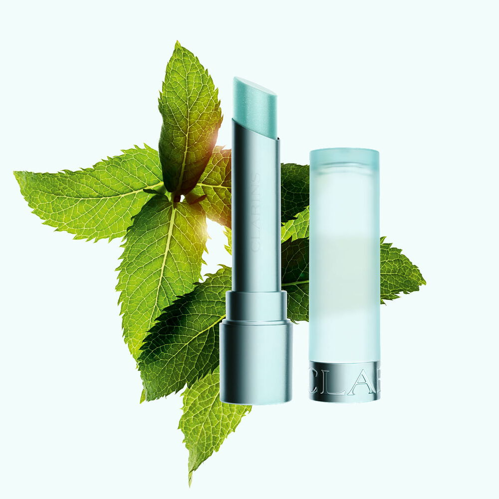 Packshot of the cool lip balm by Clarins, emphasized by the presence of mint all around, highlighting its refreshing sensation