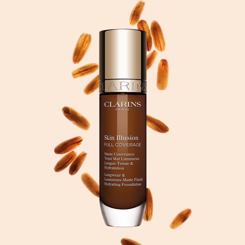 Clarins Skin Illusion Full Coverage showcasing its sleek design and vibrant packaging, the ideal foundation for a flawless & natural complexion.