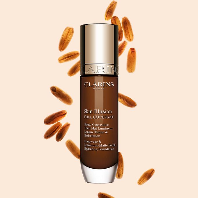 Clarins Skin Illusion Full Coverage showcasing its sleek design and vibrant packaging, the ideal foundation for a flawless & natural complexion.