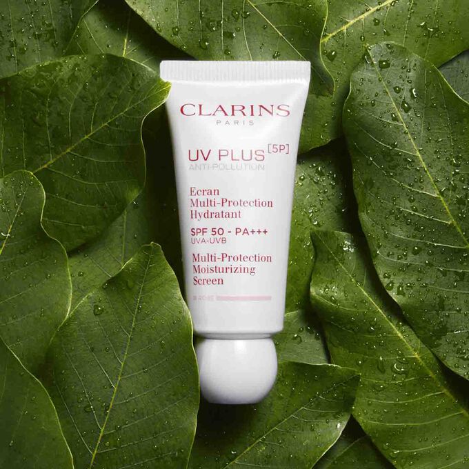 Packshot of Clarins UV Plus Anti-Pollution Rose among organic mango leaves, highlighting 62% natural origin ingredients.