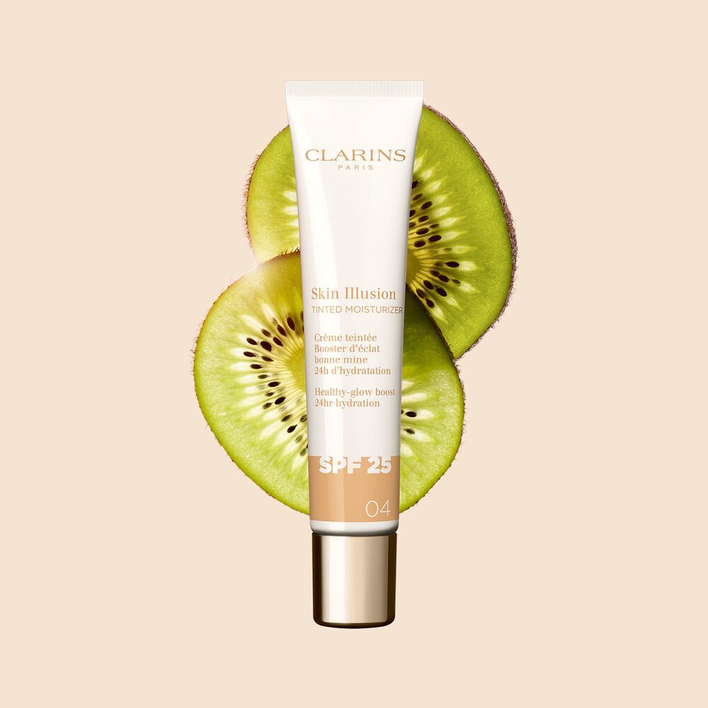 Packshot of Tinted Moisturiser with spf for medium skin shade 04, placed next to kiwi slides on a beige background