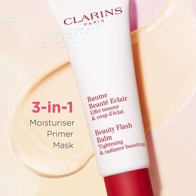 Packshot of Clarins Beauty Flash Balm on a textured background, highlighting its nourishing power for tired skin.