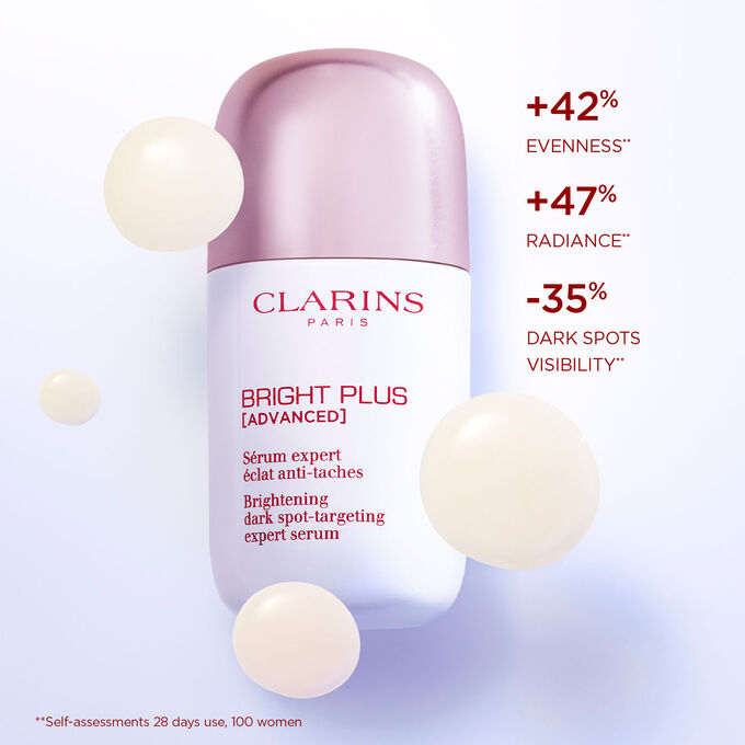Close-up of Bright Plus Expert Serum with text highlighting its effects: enhancing radiance and reducing dark spots.