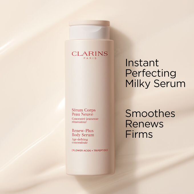 Clarins Instant Perfecting Milky Serum for the body on a textured creamy background to emphasise its smoothing and firming action.