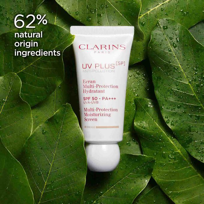 Packshot of Clarins UV Plus Anti-Pollution Beige among organic mango leaves, highlighting 62% natural origin ingredients.
