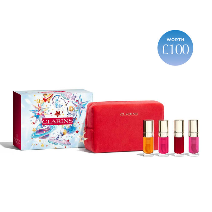 Photoshoot of the products in Clarins Lip Comfort Oil Gift set: 4 full-size lip stains in orange, fuchsia, purple and pink.
