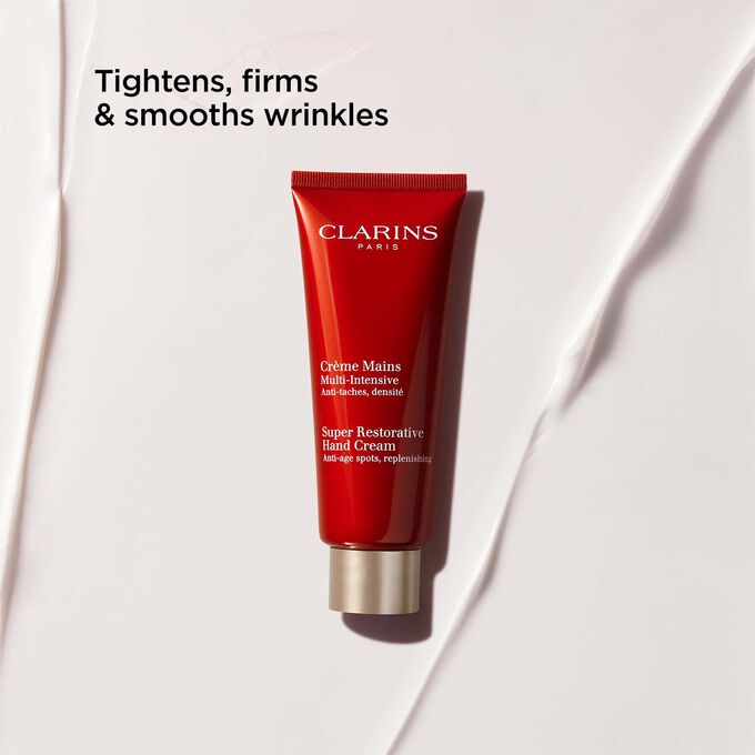 Packshot of Clarins Super Restorative Hand Cream, highlighting its tightening, firming, and wrinkle-smoothing benefits.