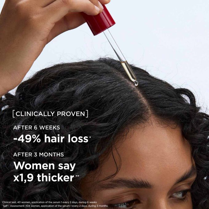 Applying hair loss serum directly to the scalp to help improve hair longevity, and stimulate density for a and promote thicker appearance
